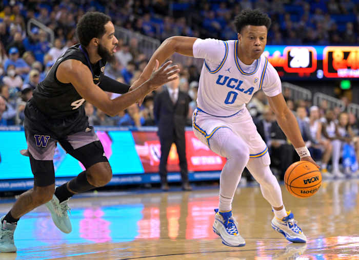 UCLA Bruins guard Jaylen Clark dribbles past Washington Huskies guard PJ Fuller II.